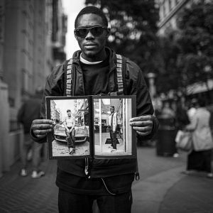 Guy holding TL USA at Powell and Market.jpg