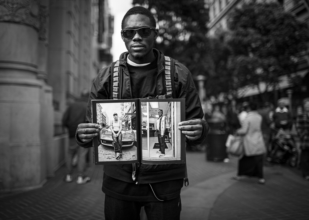 Guy holding TL USA at Powell and Market.jpg